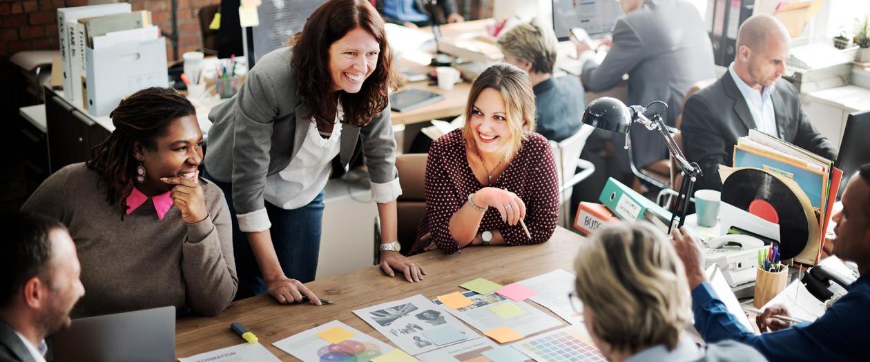 three women working at a creative agency